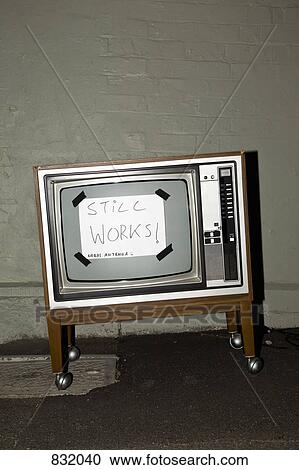 Free television on side of road with a sign 'STILL WORKS! NEEDS ANTENNA' on it View Large Photo Image Stock Image - Free television on side of road with a sign 'STILL WORKS! NEEDS ANTENNA' on it. Fotosearch