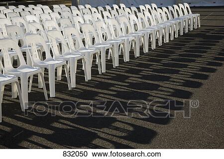 Rows of empty plastic chairs View Large Photo Image Stock Image - Rows of empty plastic chairs. Fotosearch