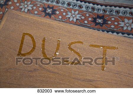 The word DUST written on a dusty table View Large Photo Image Stock Image - The word DUST written on a dusty table. Fotosearch