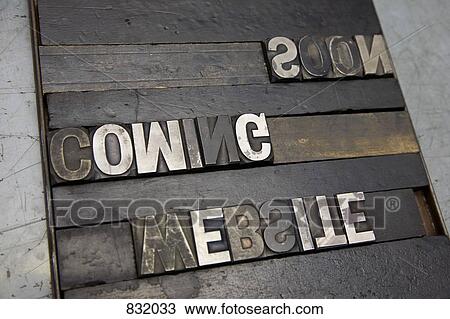 Stock Image - WEBSITE COMING SOON written backwards in metal letterpress letters. Fotosearch