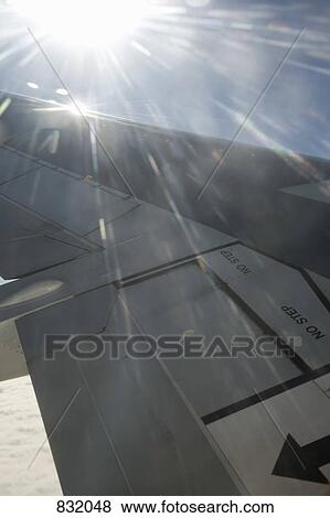 Stock Photo - Wing of a jet plane in flight. Fotosearch