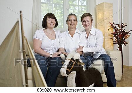 Formal portrait of a mother and her two daughters View Large Photo Image Stock Image - Formal portrait of a mother and her two daughters. Fotosearch
