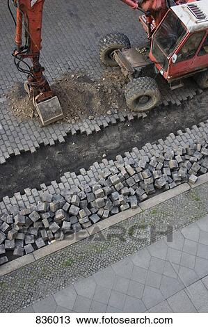 Stock Image - Excavation of a cobblestone street. Fotosearch