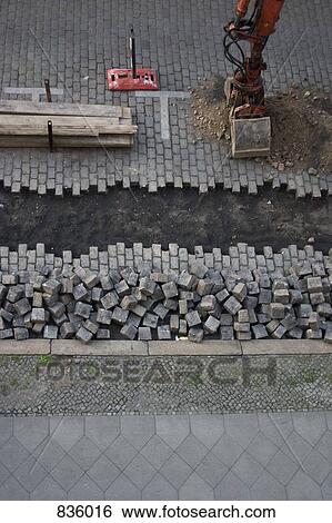 Excavation of a cobblestone street View Large Photo Image Stock Photograph - Excavation of a cobblestone street. Fotosearch