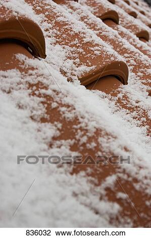 Snow on terracotta roof tiles View Large Photo Image Stock Image - Snow on terracotta roof tiles. Fotosearch