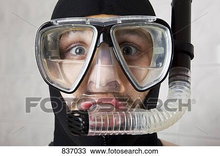 A wearing a scuba mask half full of water View Large Photo Image Stock Image - A wearing a scuba mask half full of water. Fotosearch