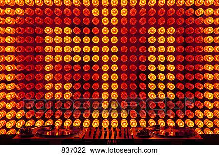 The words 'GO' spelled in lights behind two turntables and a mixing board View Large Photo Image Stock Image - The words 'GO' spelled in lights behind two turntables and a mixing board. Fotosearch