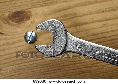 Stock Photograph - A spanner and screw. Fotosearch