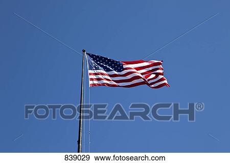 American flag flying View Large Photo Image Stock Photo - American flag flying. Fotosearch