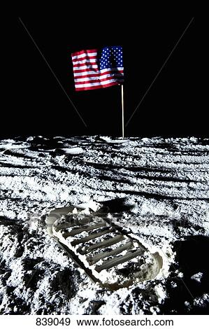 Stock Photo - An American flag and footprint on the moon. Fotosearch