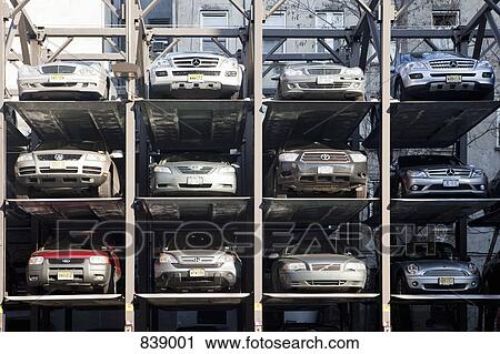 Cars in a parking lift, Manhattan, New York City, NY, USA View Large Photo Image Stock Image - Cars in a parking lift, Manhattan, New York City, NY, USA. Fotosearch