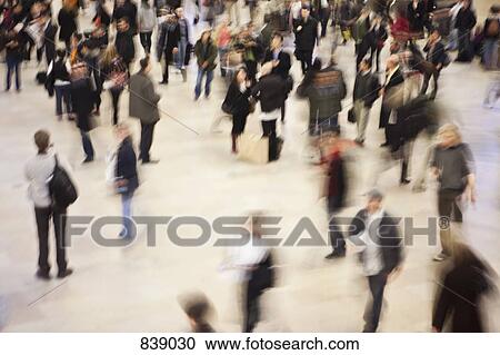 Stock Image - Pedestrians walking in a public square, Manhattan, New York City, NY, USA. Fotosearch