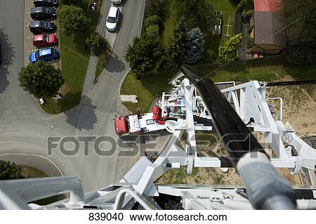 Stock Image - View from the top of fire engine ladder. Fotosearch