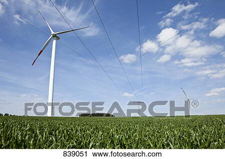 Wind turbines in a field View Large Photo Image Stock Image - Wind turbines in a field. Fotosearch