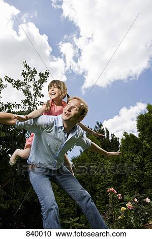 A father and daughter pretending to be planes View Large Photo Image Stock Image - A father and daughter pretending to be planes. Fotosearch