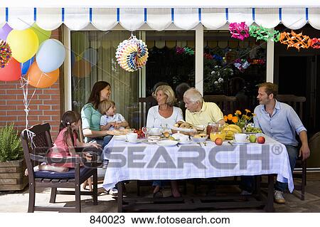 A multi-generational family having a celebration breakfast, outdoors View Large Photo Image Stock Image - A multi-generational family having a celebration breakfast, outdoors. Fotosearch