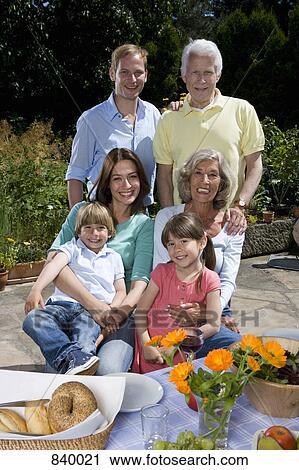 A multi-generational family having breakfast, outdoors View Large Photo Image Stock Image - A multi-generational family having breakfast, outdoors. Fotosearch