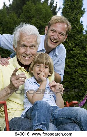 Portrait of a man with his son and grandson View Large Photo Image Stock Photograph - Portrait of a man with his son and grandson. Fotosearch