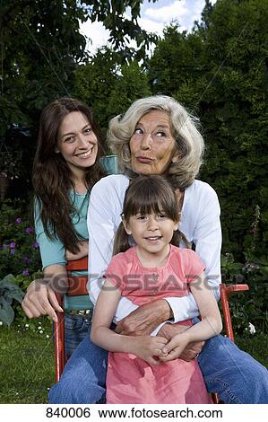 Stock Photograph - Portrait of a woman with her daughter and granddaughter. Fotosearch