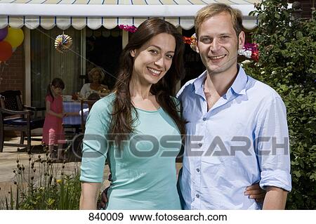 Portrait of mid adult couple, outdoors View Large Photo Image Stock Photo - Portrait of mid adult couple, outdoors. Fotosearch