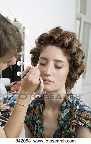 A make-up artist applying make-up on a model View Large Photo Image Stock Photo - A make-up artist applying make-up on a model. Fotosearch