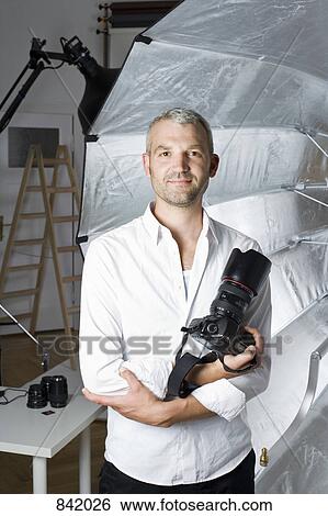 Portrait of a photographer View Large Photo Image Stock Photograph - Portrait of a photographer. Fotosearch