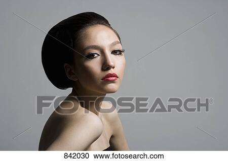 Portrait of a teenage girl with a beehive hairstyle View Large Photo Image Stock Image - Portrait of a teenage girl with a beehive hairstyle. Fotosearch