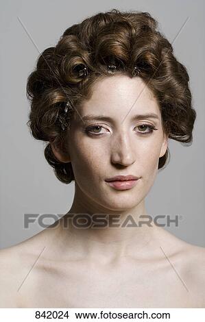 Portrait of a young woman with her hair in rollers View Large Photo Image Picture - Portrait of a young woman with her hair in rollers. Fotosearch