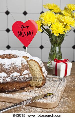 A Bundt cake, flowers and a gift box for Mother's Day in Germany View Large Photo Image Stock Photography - A Bundt cake, flowers and a gift box for Mother's Day in Germany. Fotosearch