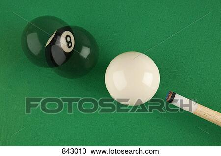 A pool cue, cue ball and eight ball on a pool table, multiple exposure View Large Photo Image Stock Image - A pool cue, cue ball and eight ball on a pool table, multiple exposure. Fotosearch