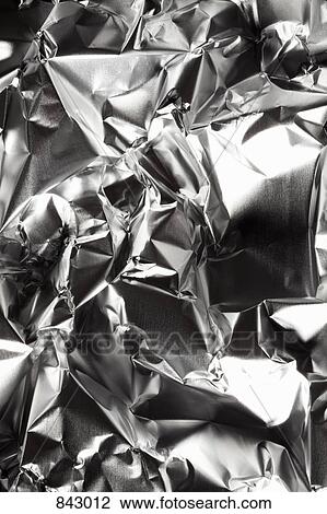 Stock Image - Crushed aluminum, full frame, background. Fotosearch