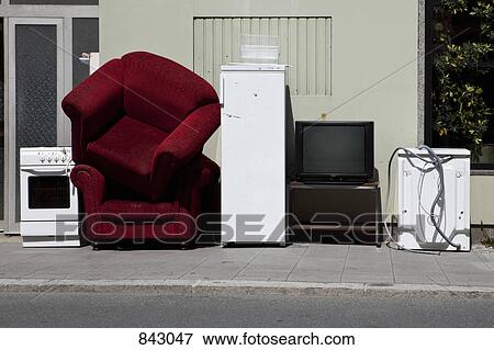 Furniture and appliances on a sidewalk waiting to be moved View Large Photo Image Stock Photo - Furniture and appliances on a sidewalk waiting to be moved . Fotosearch