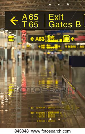 Signs in an airport View Large Photo Image Stock Photo - Signs in an airport. Fotosearch