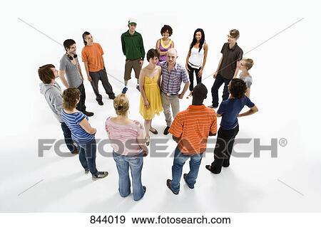 A couple surrounded by a group of men and women View Large Photo Image Stock Photo - A couple surrounded by a group of men and women. Fotosearch