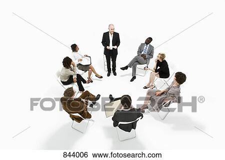 A group of business people in a meeting View Large Photo Image Stock Photograph - A group of business people in a meeting. Fotosearch