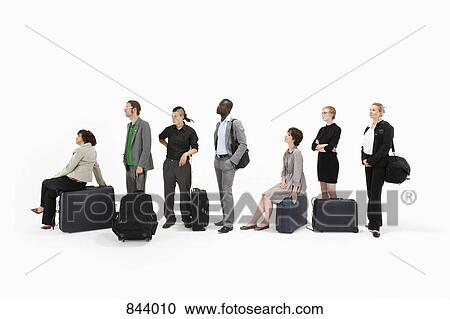 A group of business people standing in a line with luggage View Large Photo Image Stock Image - A group of business people standing in a line with luggage. Fotosearch