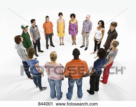 Stock Image - A group of men and women forming a circle. Fotosearch