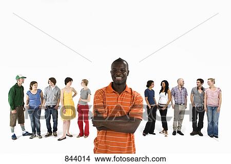 A young man in front of a row of men and women View Large Photo Image Picture - A young man in front of a row of men and women. Fotosearch