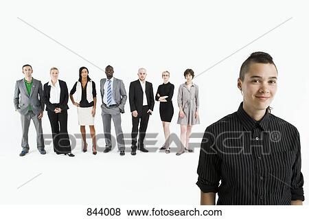 A young professional in front of a row of business people View Large Photo Image Stock Photo - A young professional in front of a row of business people. Fotosearch