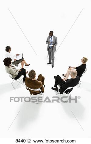 Stock Image - Business people in a meeting. Fotosearch