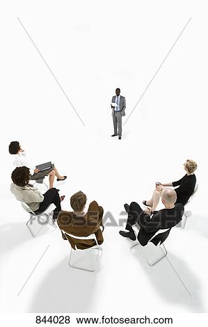 Business people in a meeting View Large Photo Image Stock Photo - Business people in a meeting. Fotosearch