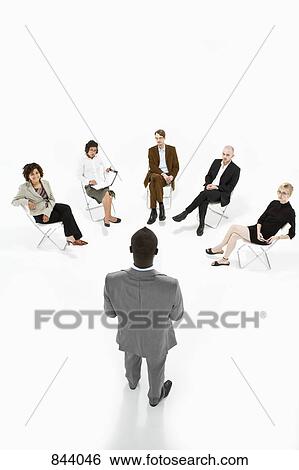 Stock Photograph - Business people in a meeting. Fotosearch