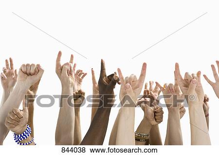 Detail of people with raised hands gesturing View Large Photo Image Stock Photo - Detail of people with raised hands gesturing. Fotosearch