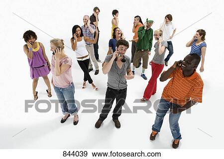 Group of men and women using mobile phones View Large Photo Image Stock Photo - Group of men and women using mobile phones. Fotosearch
