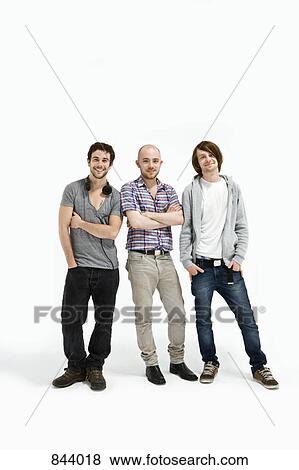 Three men standing together View Large Photo Image Stock Photo - Three men standing together. Fotosearch