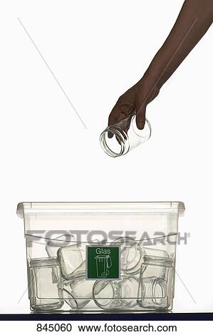 A human hand throwing a glass jar in a recycling bin View Large Photo Image Stock Image - A human hand throwing a glass jar in a recycling bin. Fotosearch