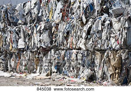 Bundles of cardboard at a recycling center View Large Photo Image Stock Photo - Bundles of cardboard at a recycling center. Fotosearch