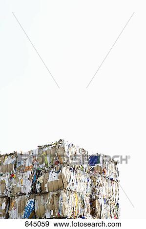 Stock Photo - Bundles of cardboard at a recycling center. Fotosearch