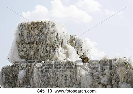 Stock Image - Bundles of plastic at a recycling center. Fotosearch