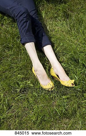 The low section of a young woman wearing peep toe shoes View Large Photo Image Stock Photography - The low section of a young woman wearing peep toe shoes. Fotosearch